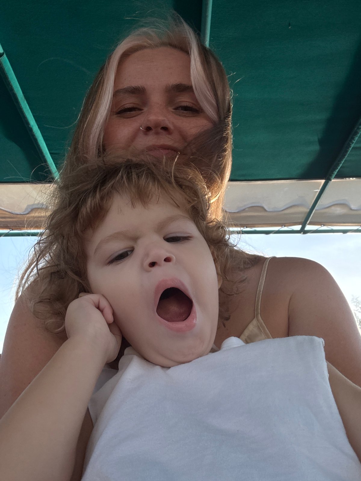 Mother and child capture moments during Thailand waterfront visit
