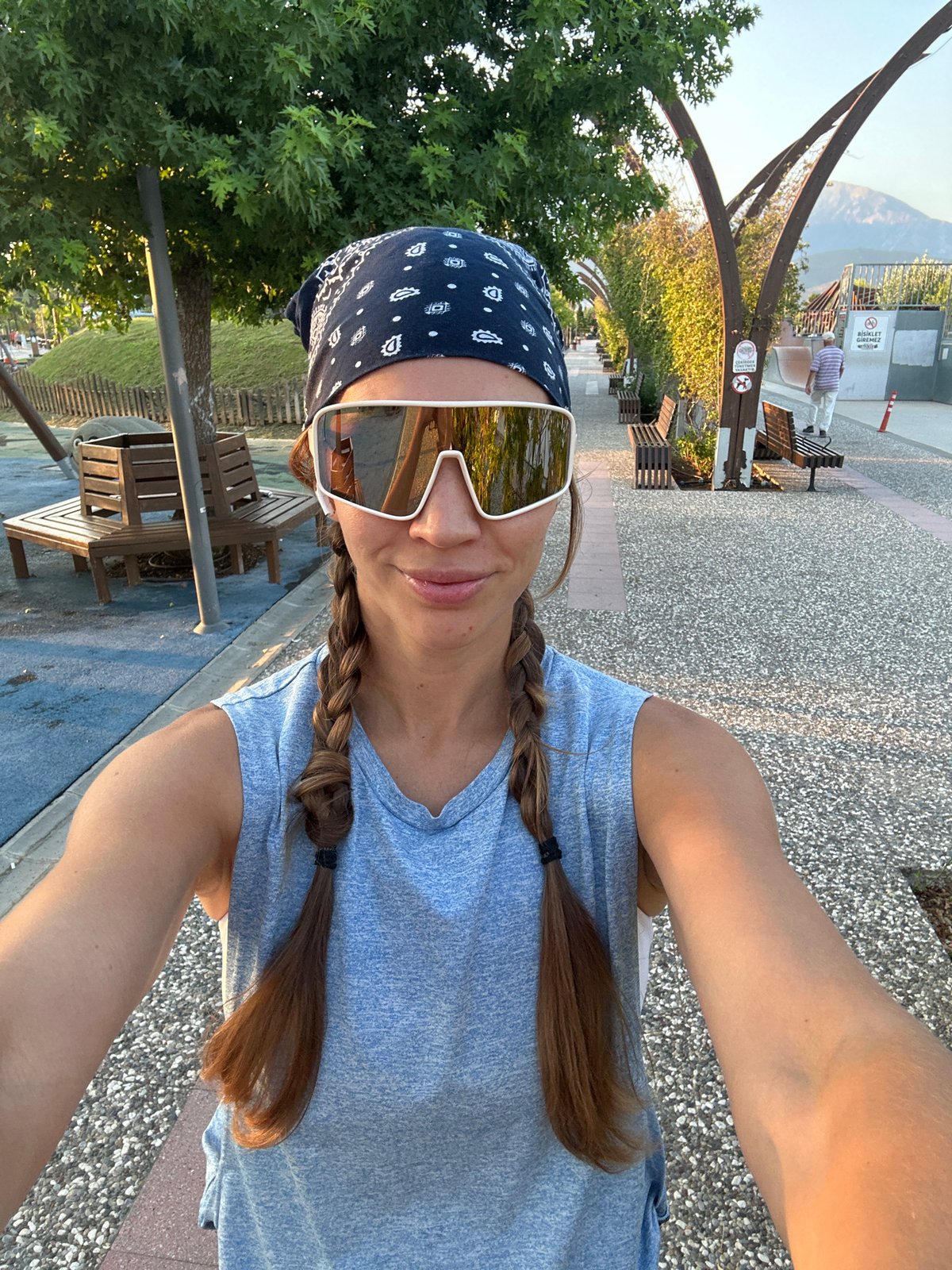 Selfie moment at a Fethiye park, blue bandana and white shades