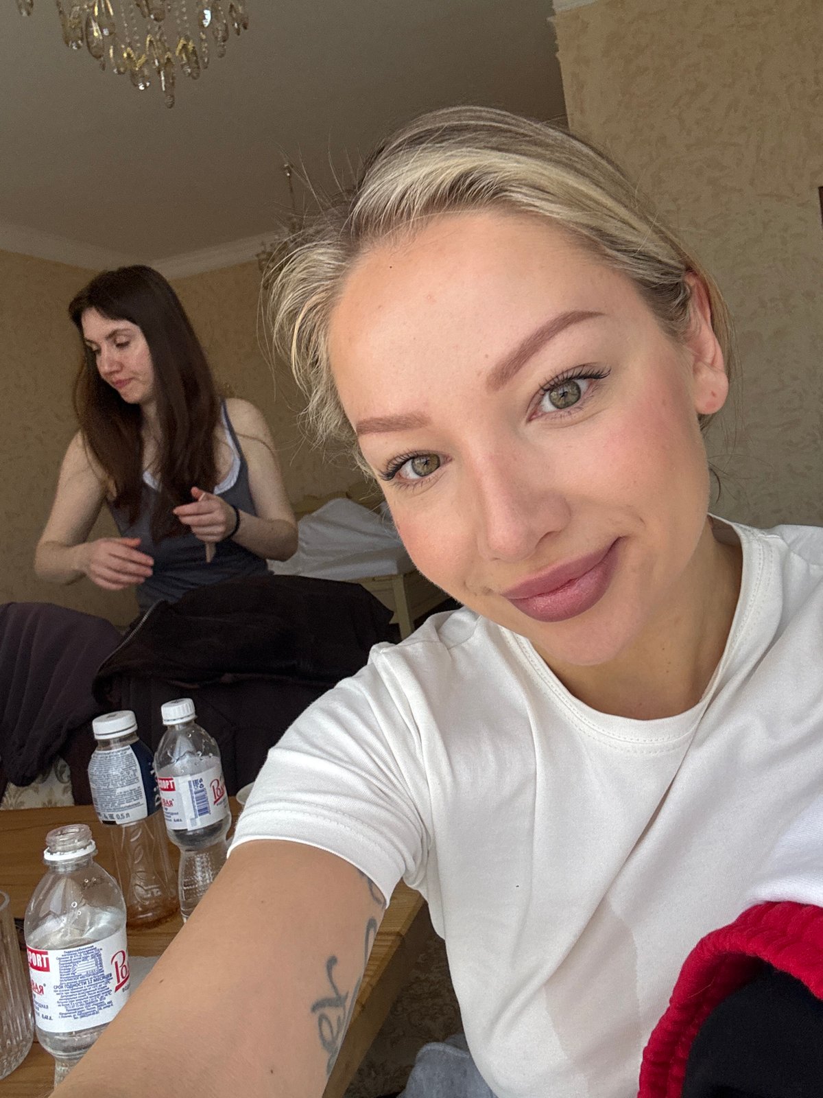 Woman takes selfie in hotel room in Baksan, Russia