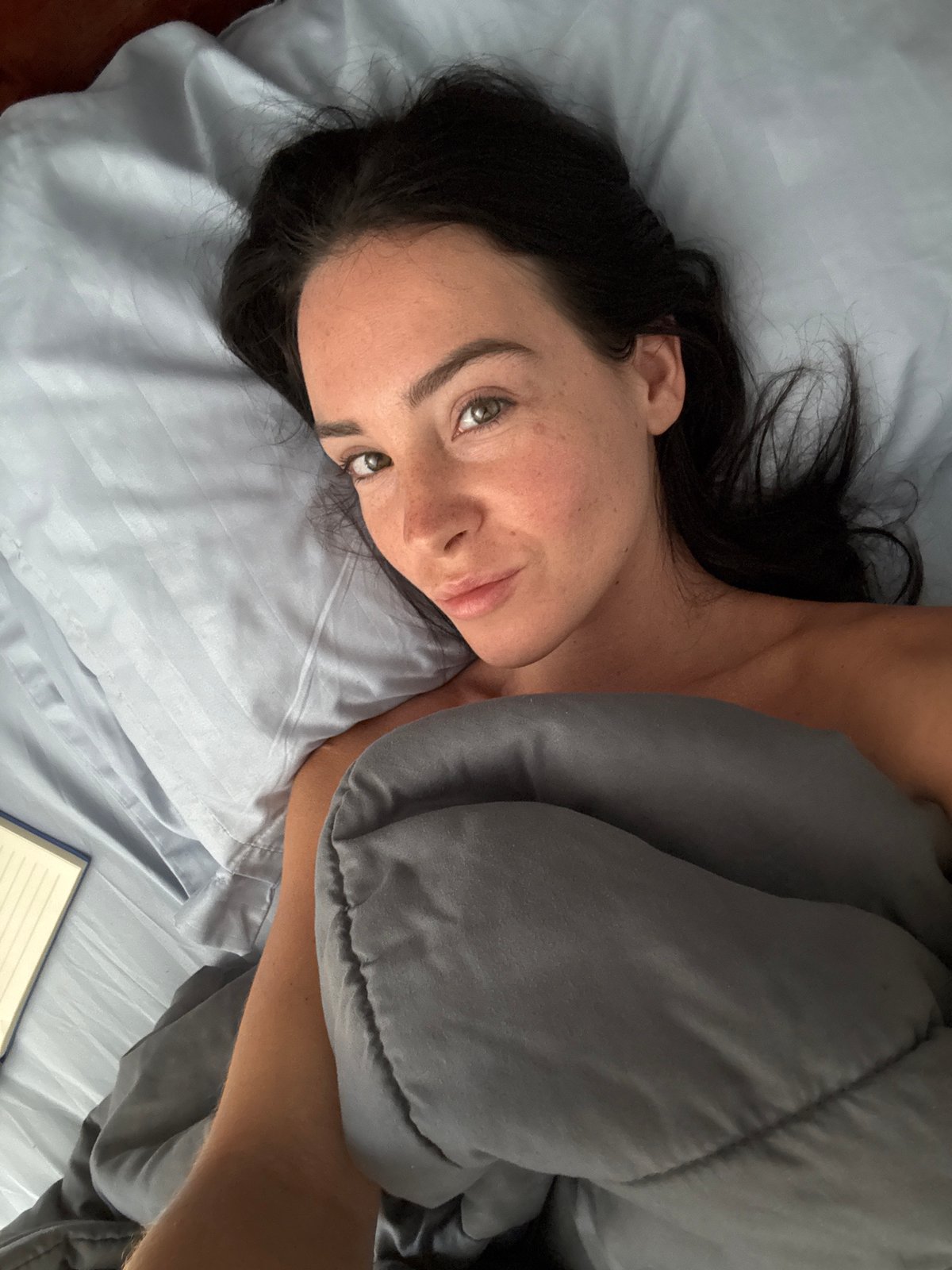 Lazy morning in a Bali hotel room, temple activity nearby