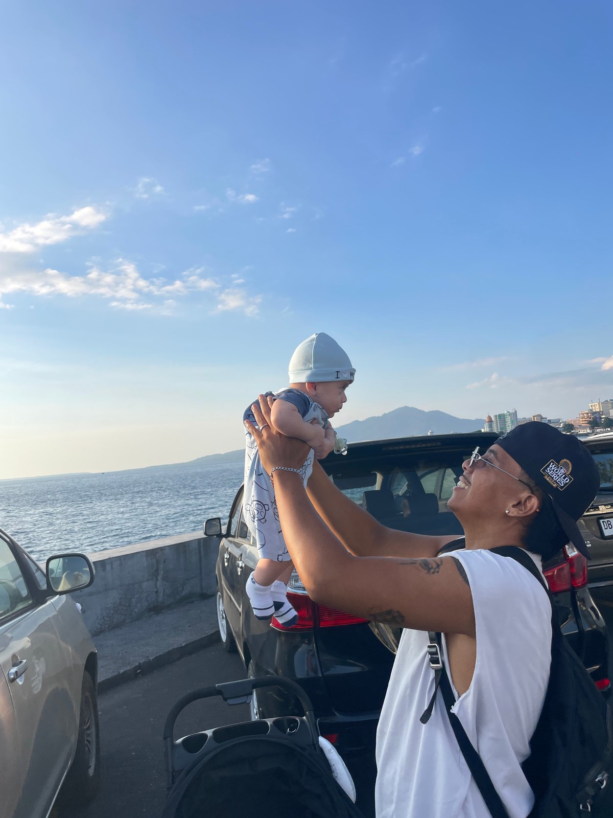 Waterfront stop in Manado with bay views and a baby moment