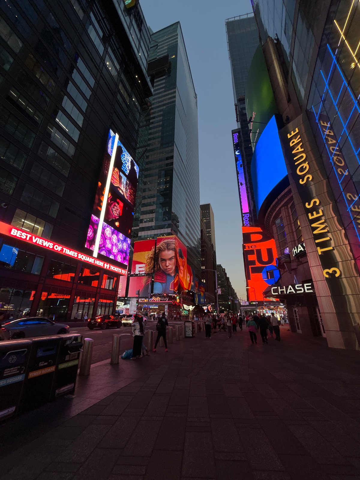 Late night crowds gather in illuminated Times Square
