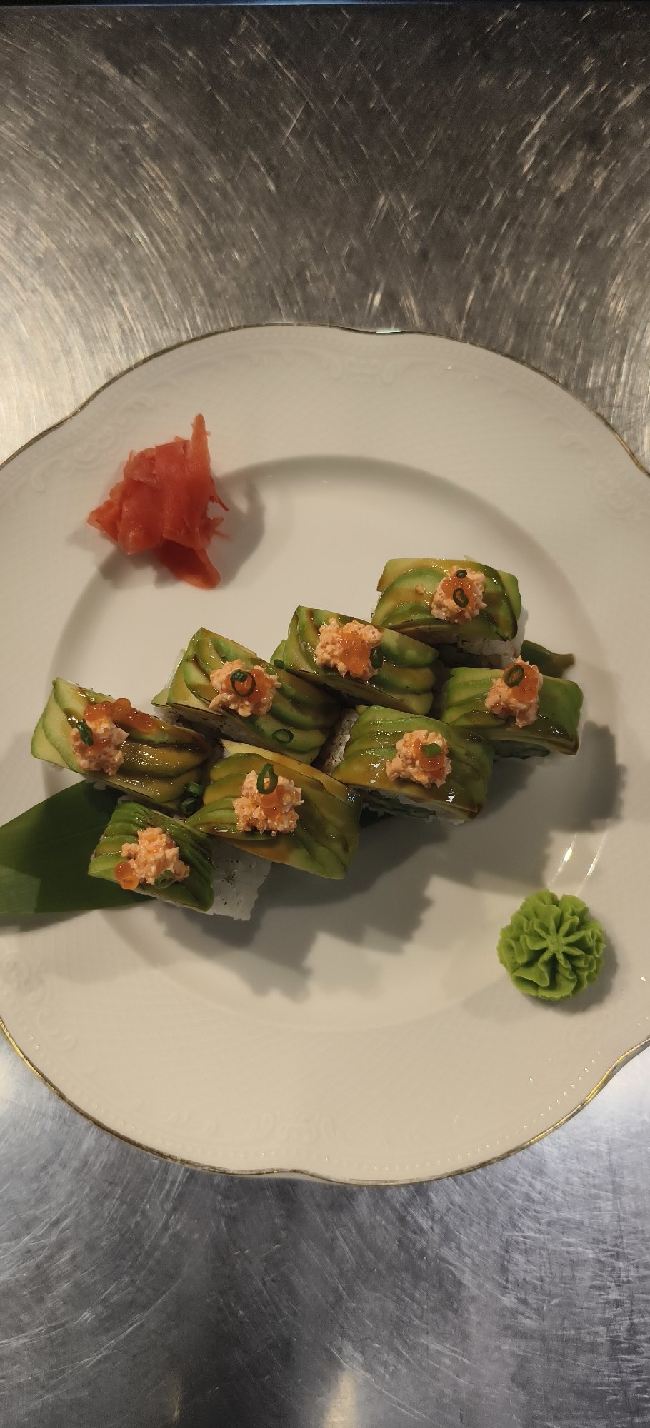 Sushi plate with eight rolls observed at dining location
