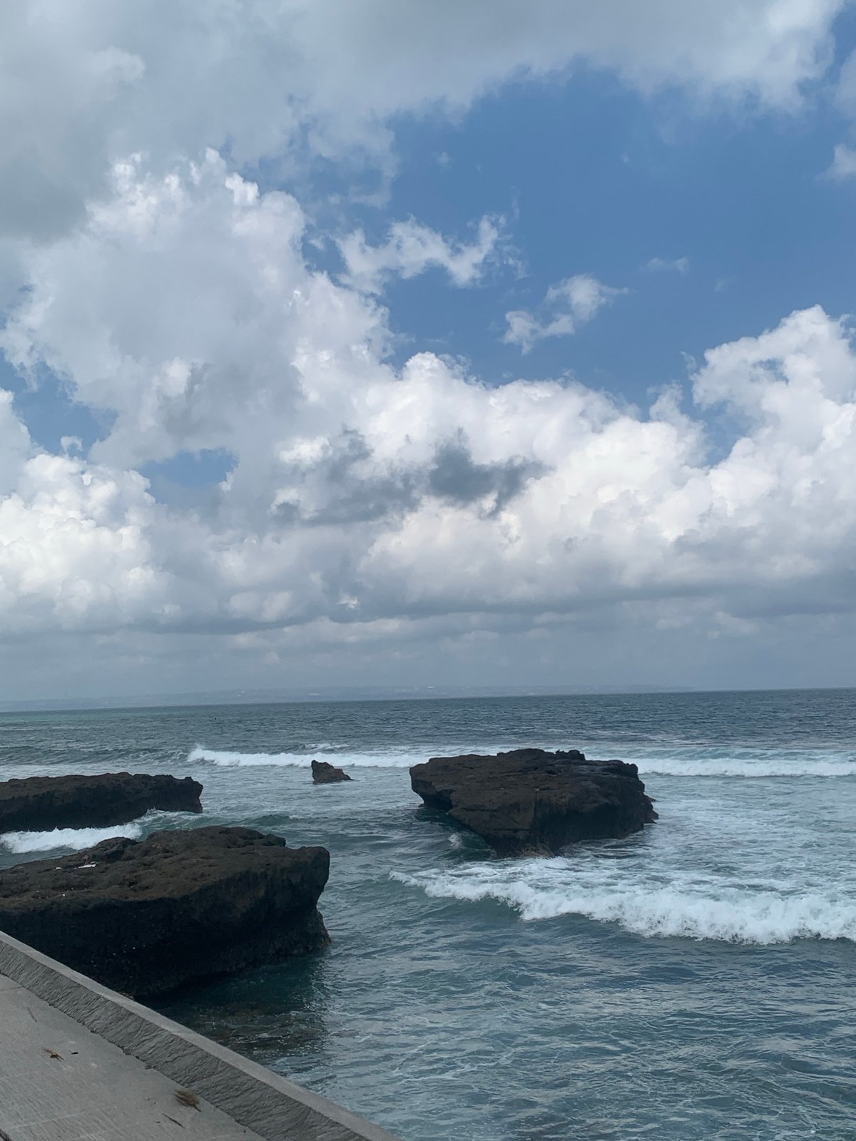 Relaxing along the rocky coastline of North Kuta, Bali