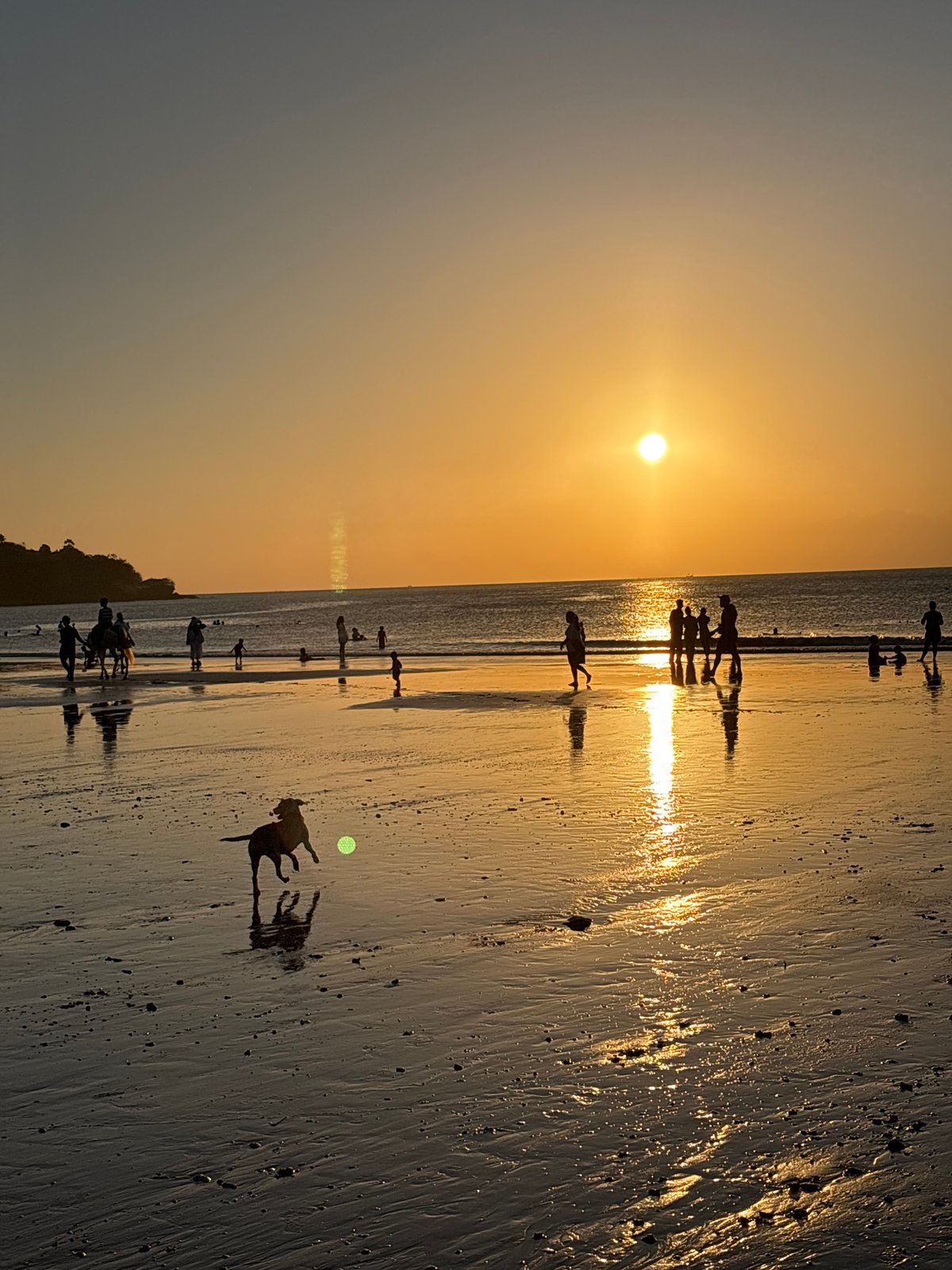 Crowded golden hour at Kuta Beach, Bali