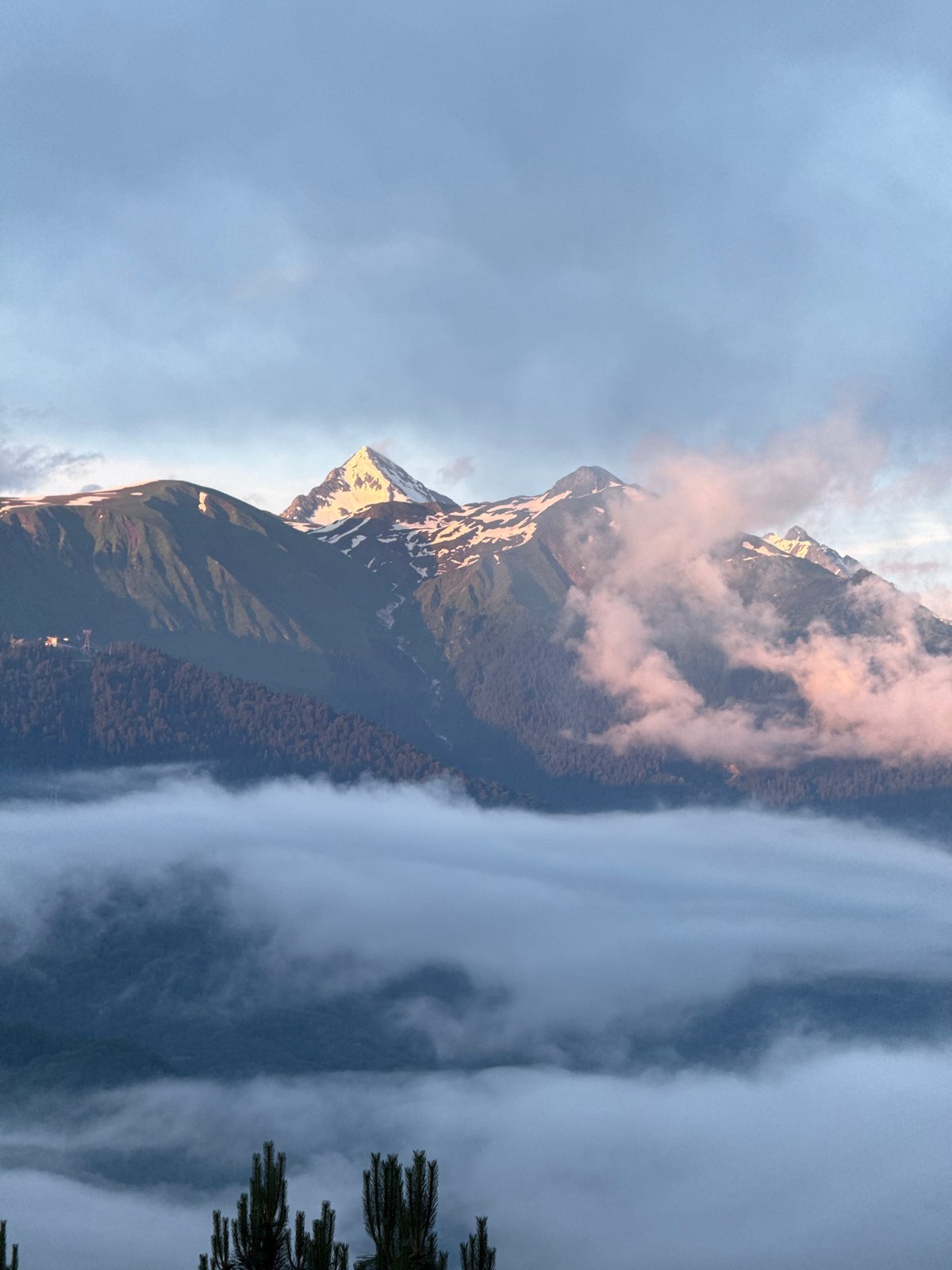 Outdoor gathering in Estosadok with stunning Caucasus mountain backdrop