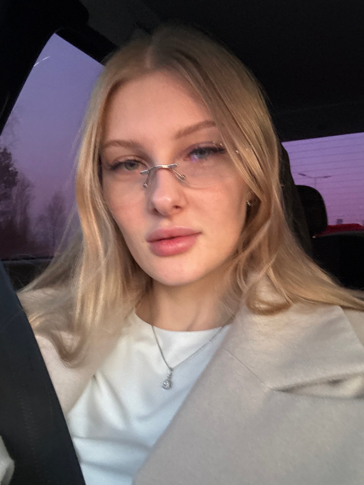 Woman with unique nose piercing photographed in car, Perm