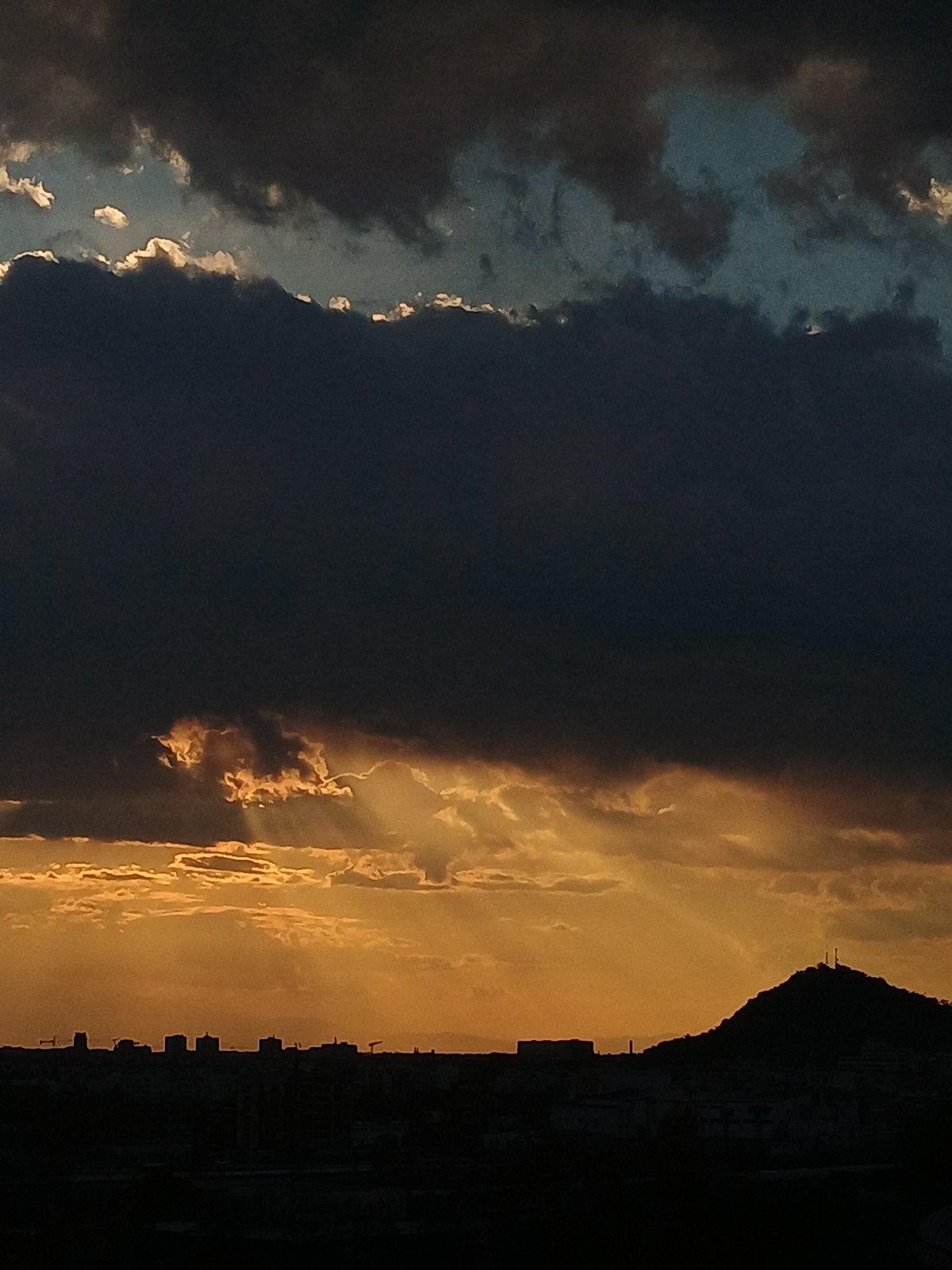 Dramatic sunset with storm clouds captured over Plovdiv, Bulgaria