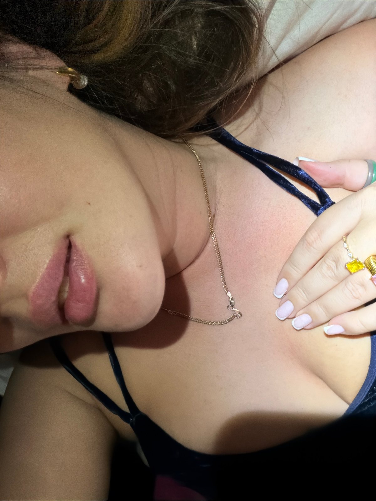 Woman photographed resting on bed in Kazan