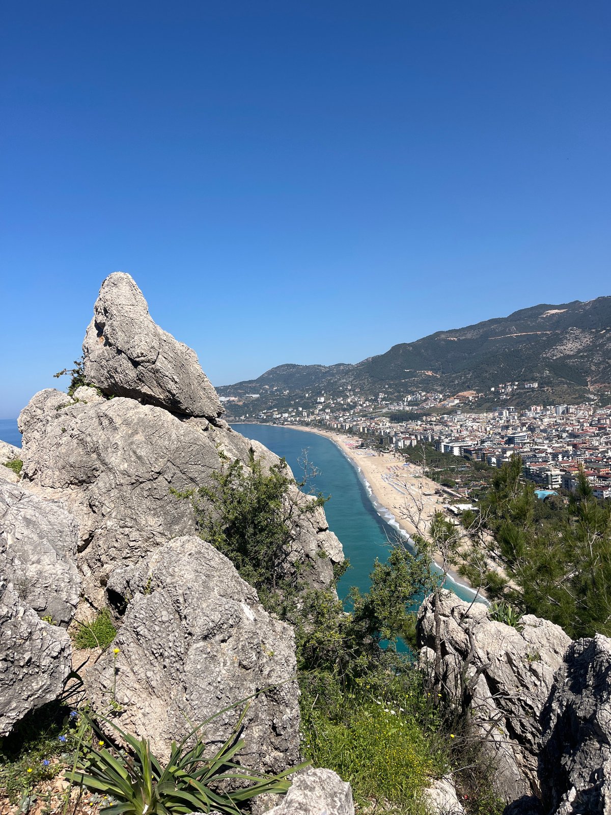 Tourist captures scenic coastal views from Alanya clifftop overlook