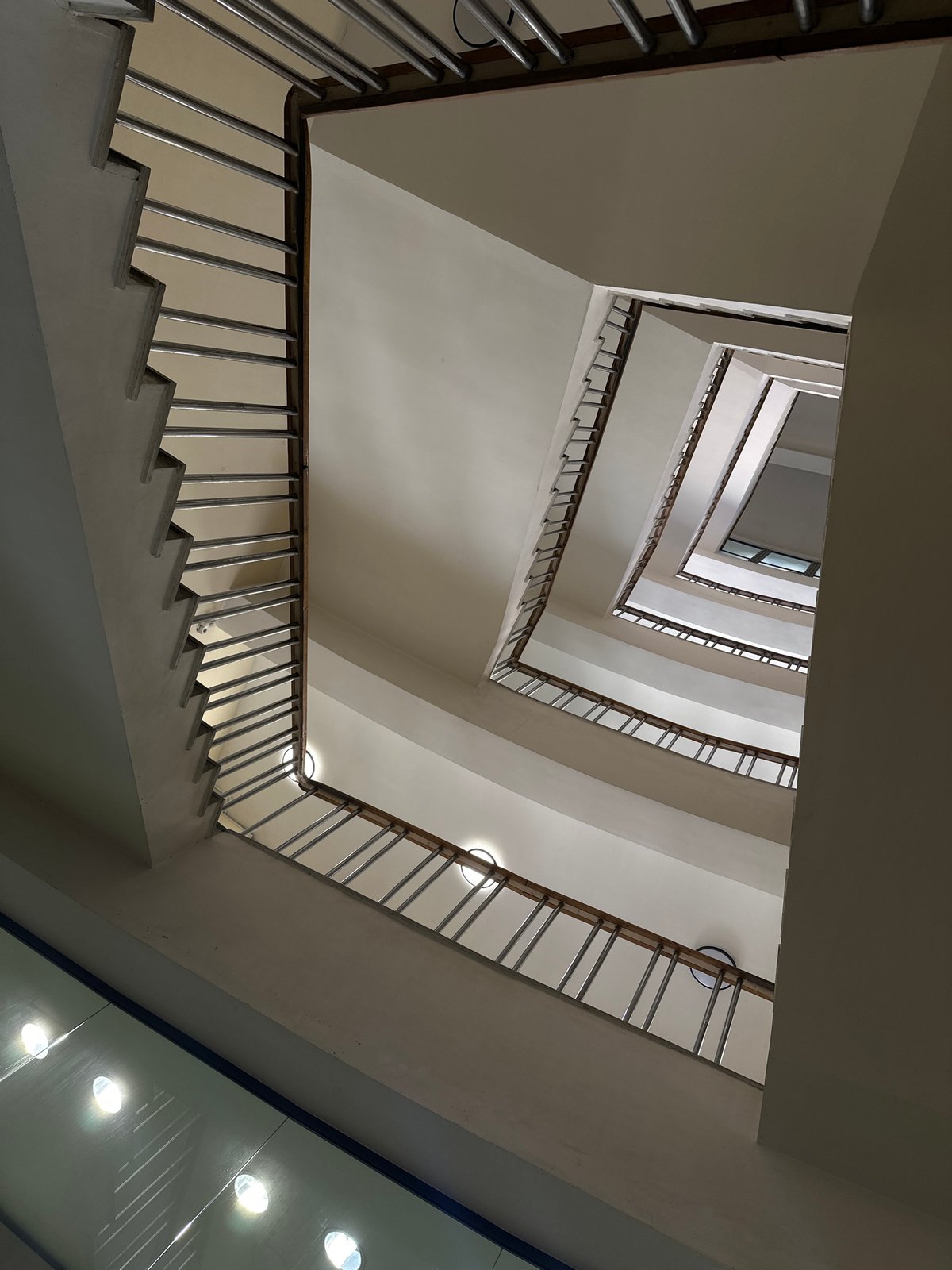 Upward view captured of spiral stairwell in Yerevan