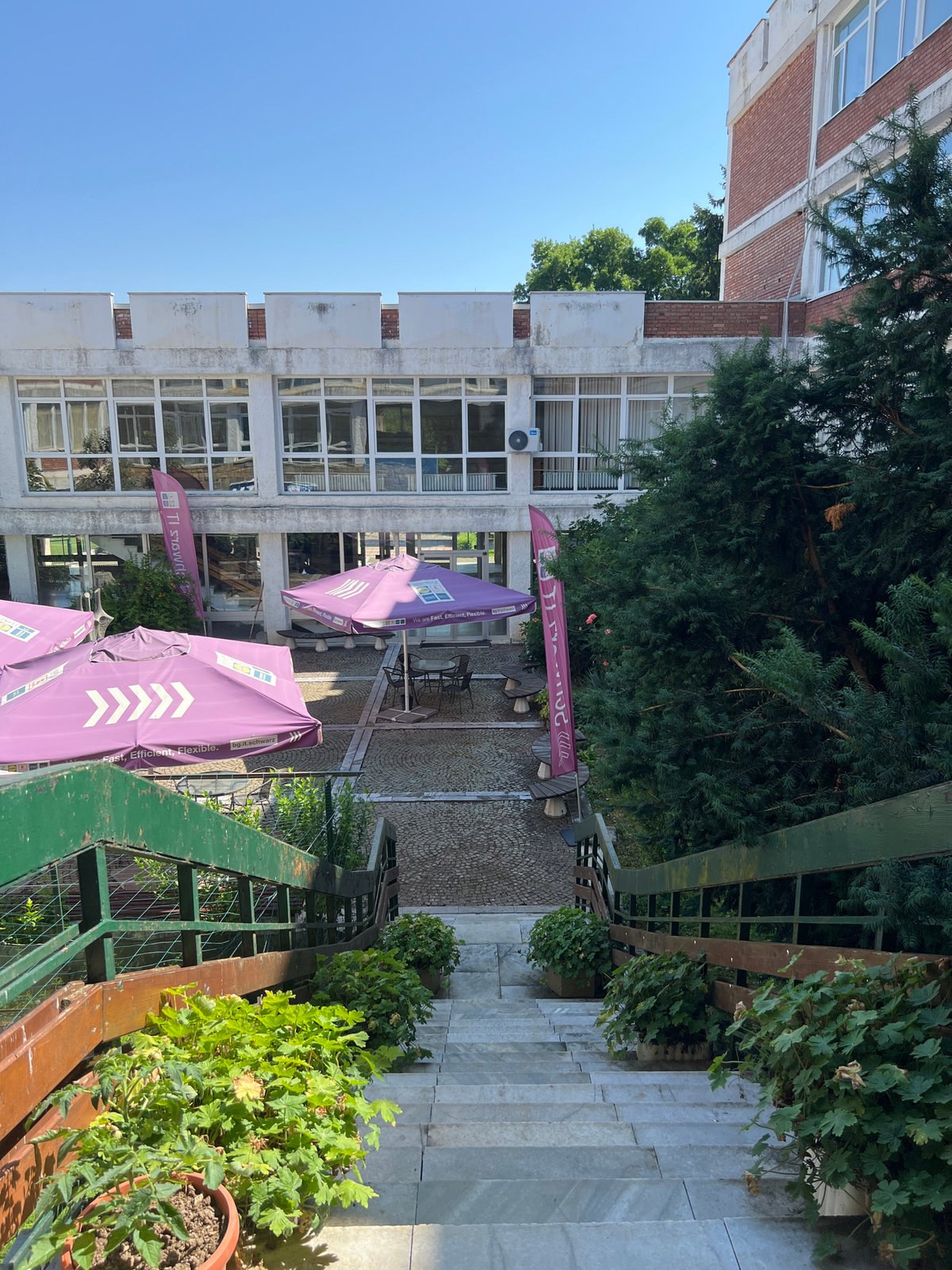 Outdoor staircase and robot mural at a building in Pravets