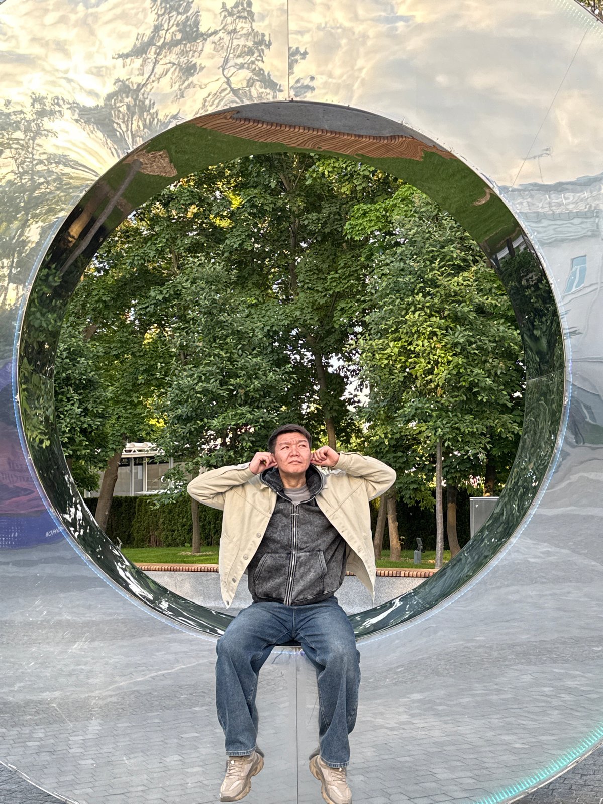 Moscow visitors playfully engage with reflective art installations across city parks