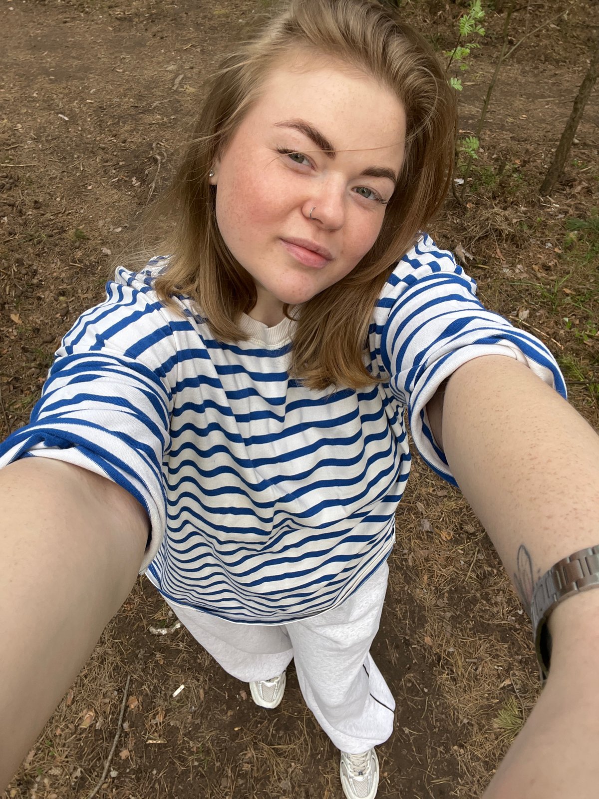 Family enjoys afternoon forest walk in Chaikovsky, Russia