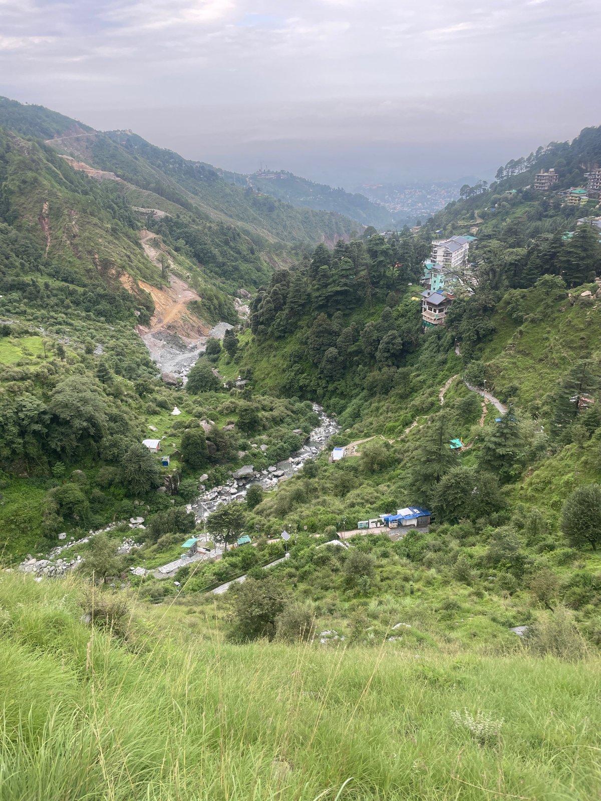 Trekking Bhagsu's waterfall trail through shrines and mountain greenery