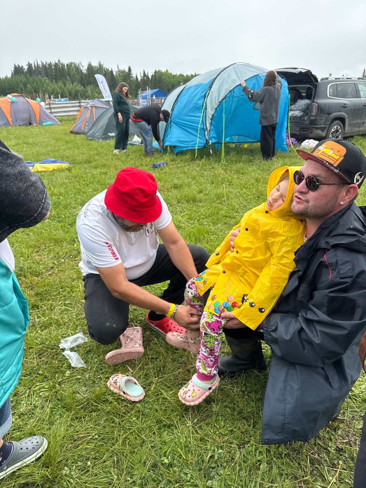 Outdoor festival with stage and food draws crowds in rural Russia