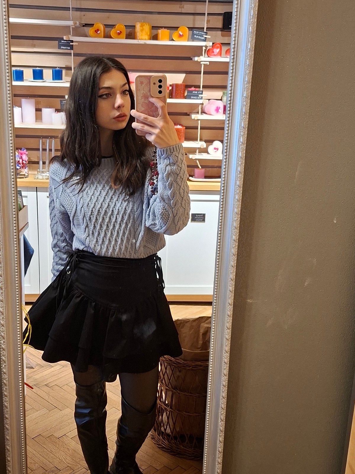 Woman takes mirror selfie in spring outfit
