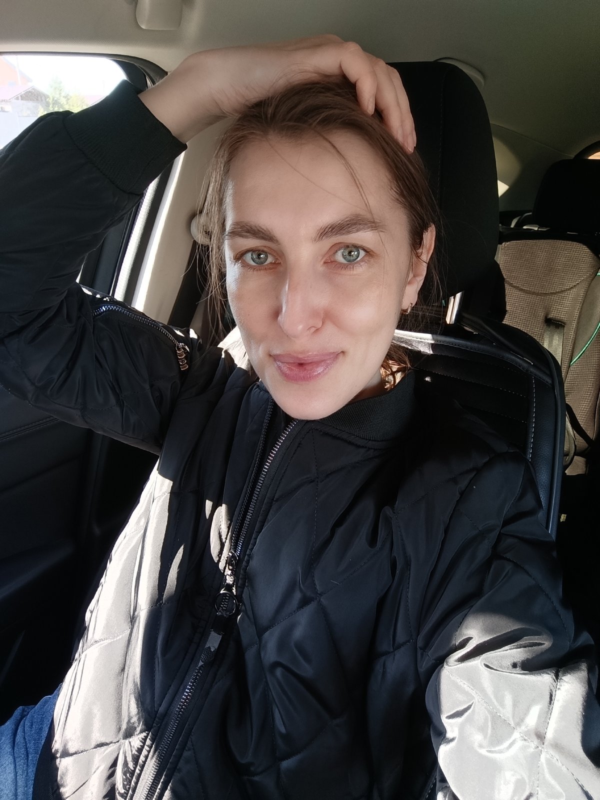 Woman takes car selfies in Chaikovsky, Russia