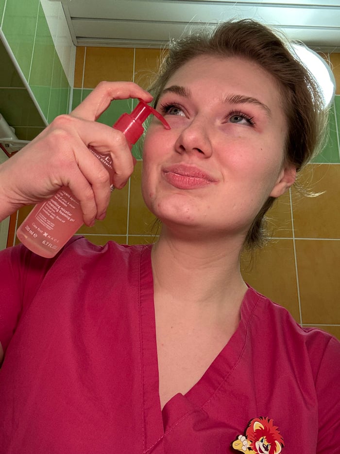 Healthcare worker documents evening skincare routine in Kazan bathroom