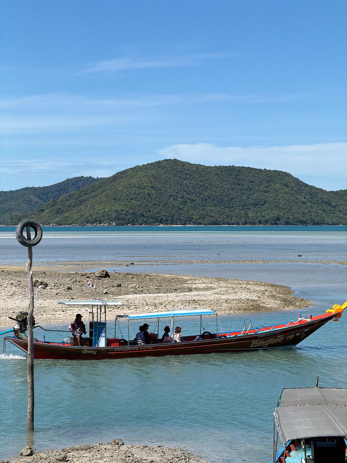 Longtail boats and beach life at Baan Thong Krut