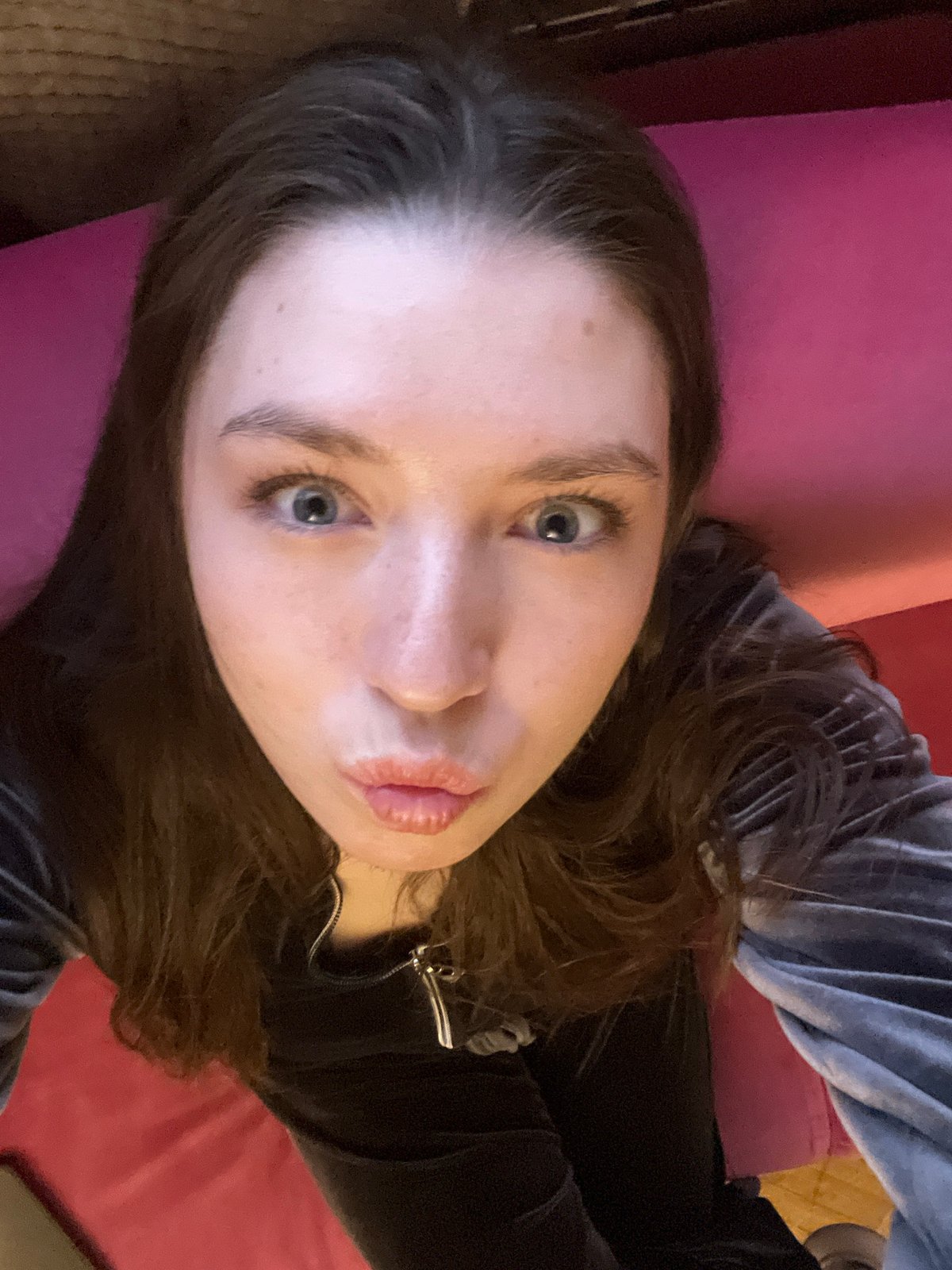 Woman resting on red surface observed in Moscow