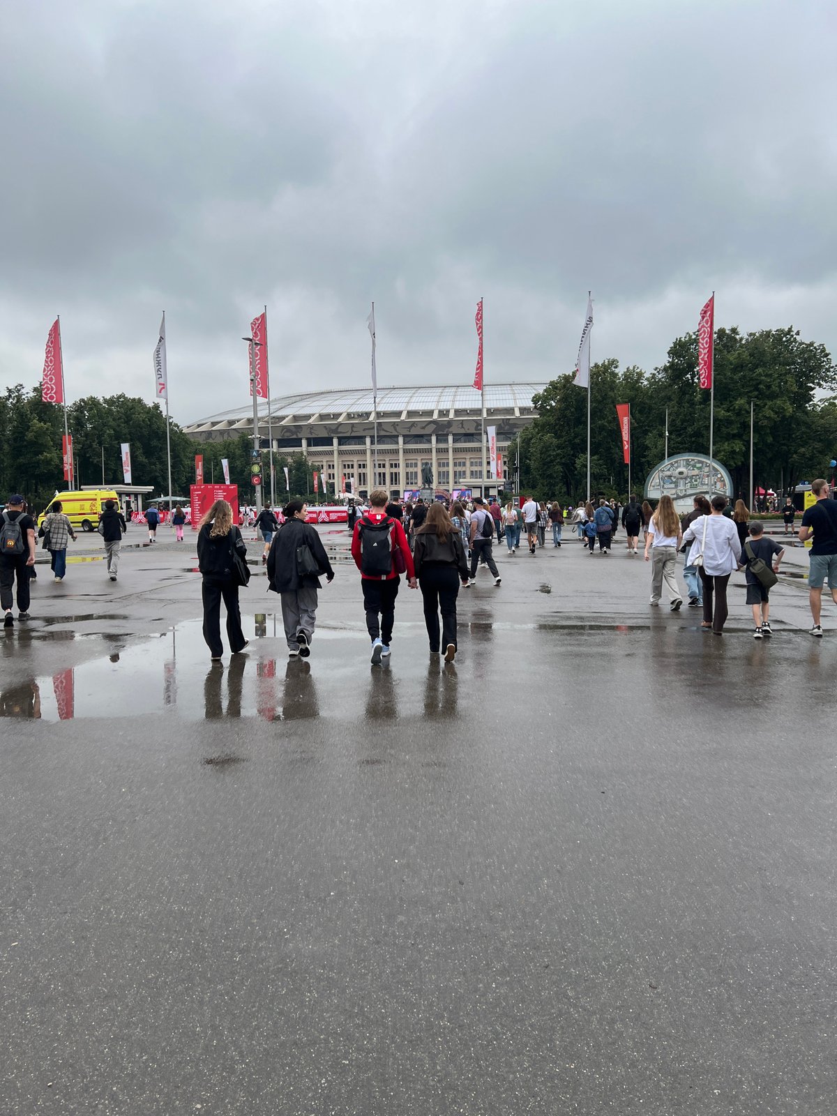 Crowds outside Luzhniki Stadium on a wet Moscow day