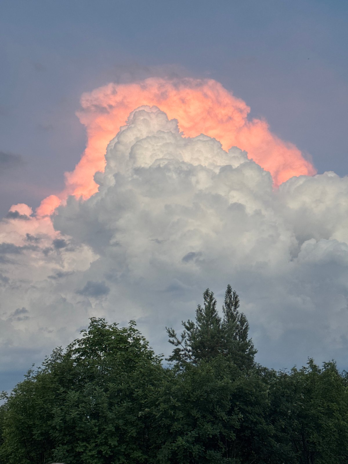 Dramatic sunset illuminates towering clouds at location 666