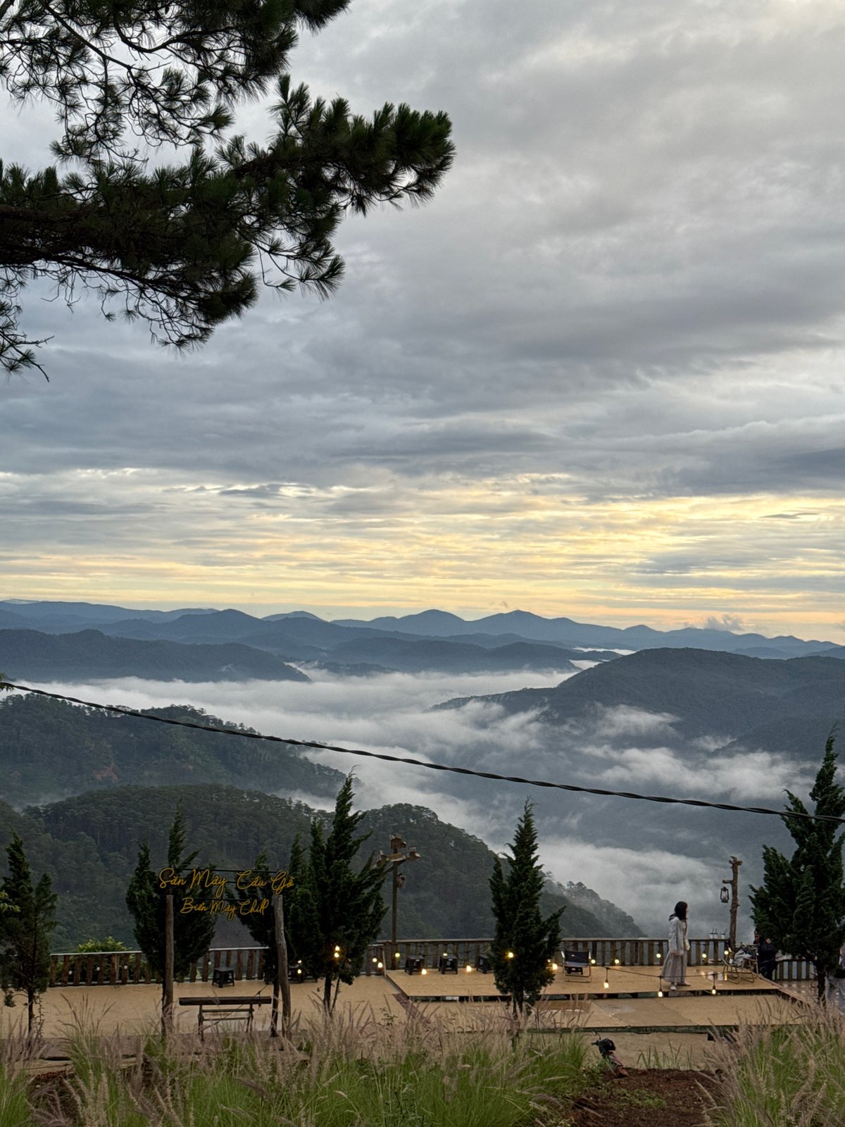 Evening mountain views with wind turbines captured in Phát Chi
