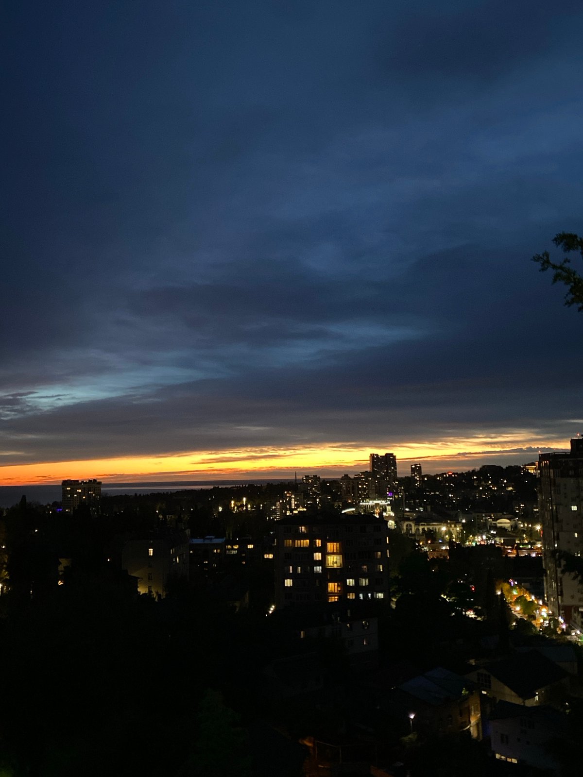 Evening twilight colors observed over Sochi cityscape