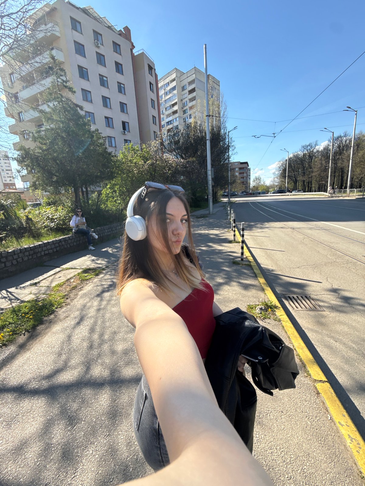 Woman takes selfie with leather jacket in Sofia