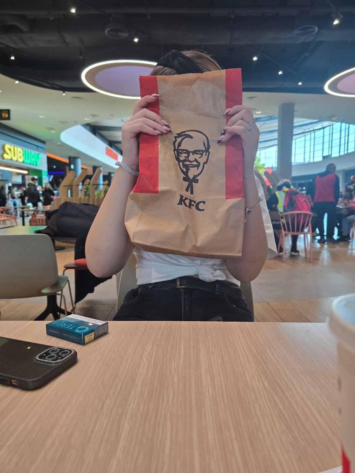 KFC bag spotted on wooden surface in Burgas