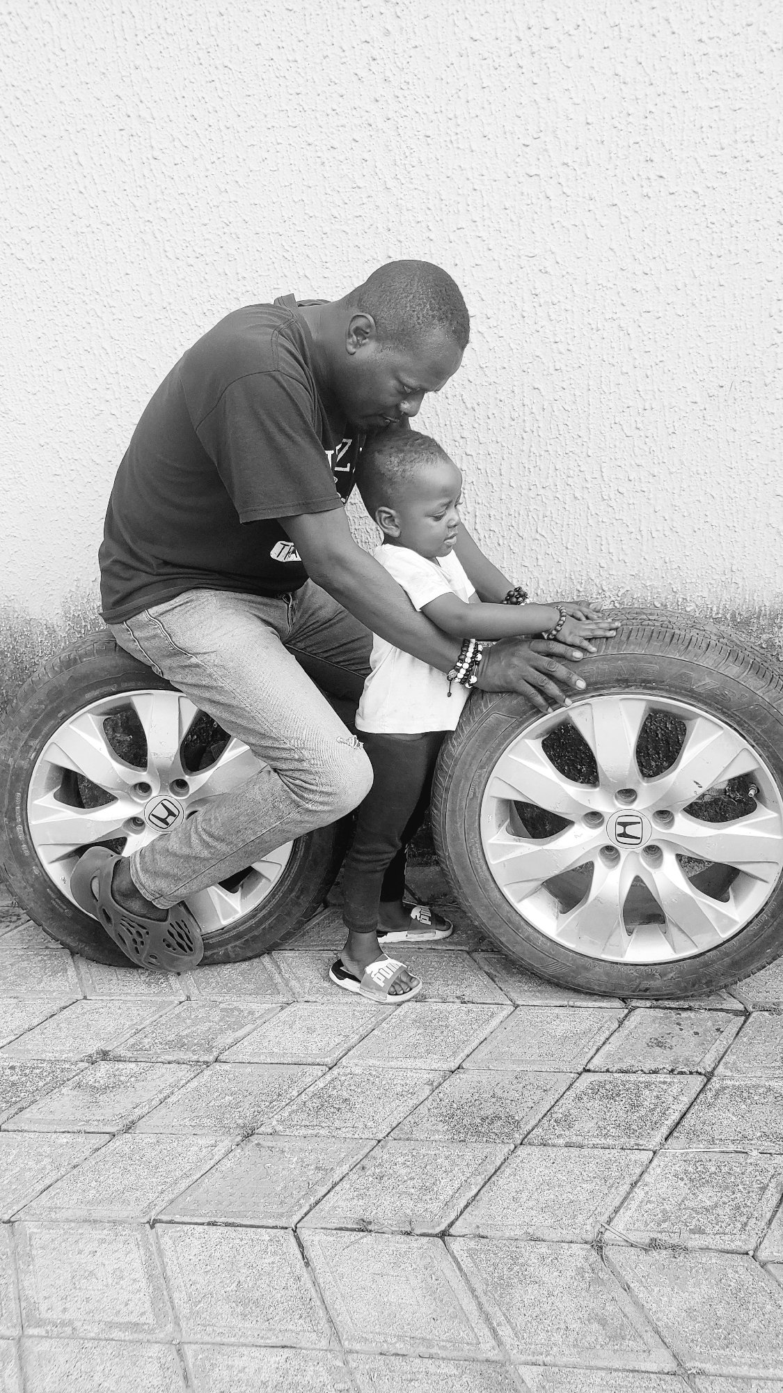 Adult and child share tender moment in Narayi, Nigeria