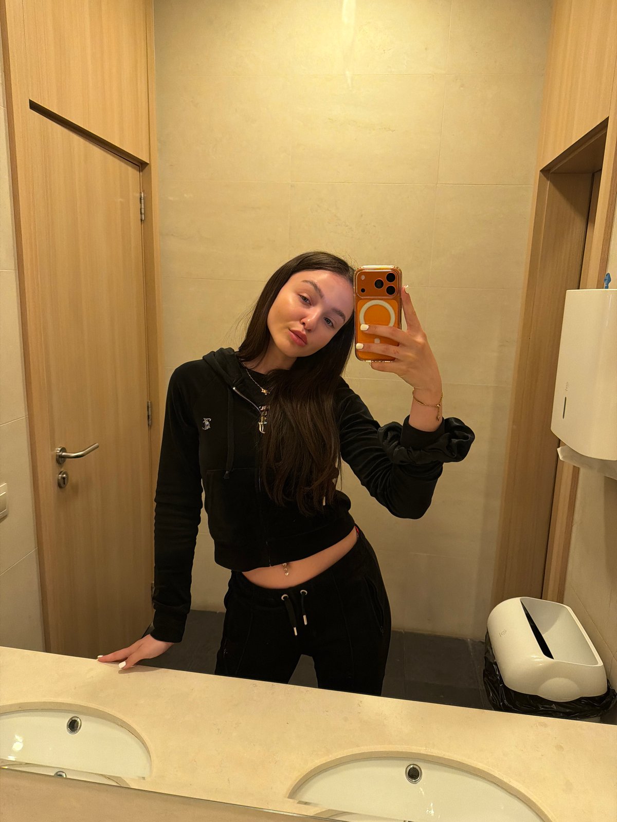 Woman Takes Mirror Selfie in Sofia Public Restroom