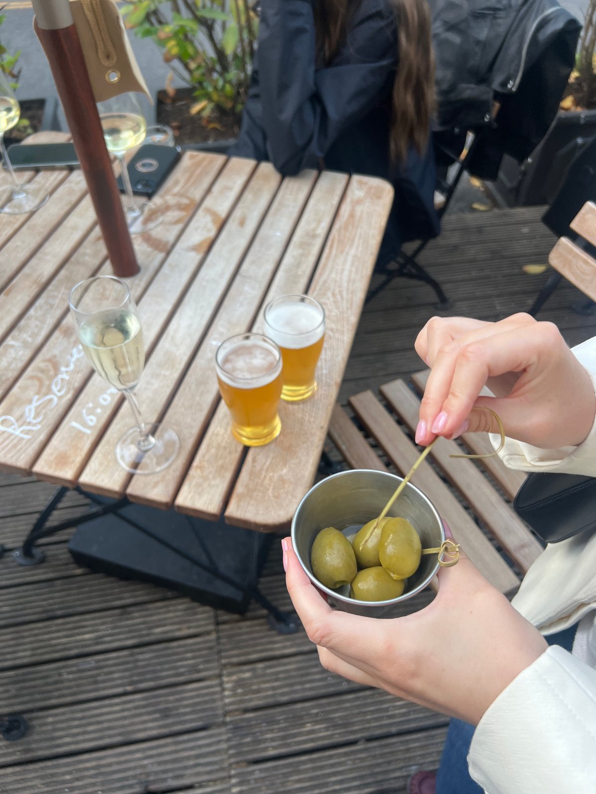 Evening drinks and dining captured at London outdoor restaurant