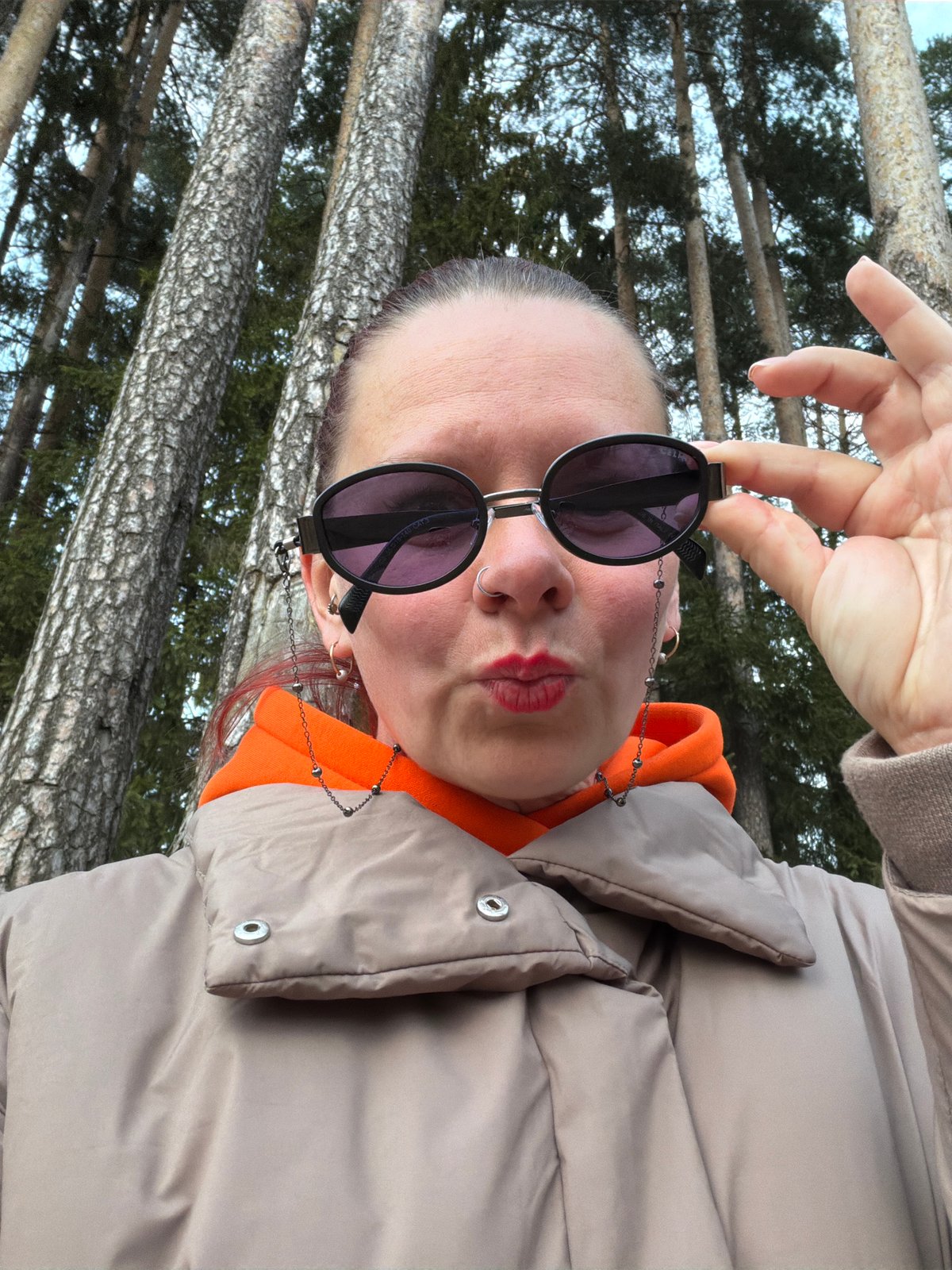 Person in orange jacket documented around Chaikovsky, Russia