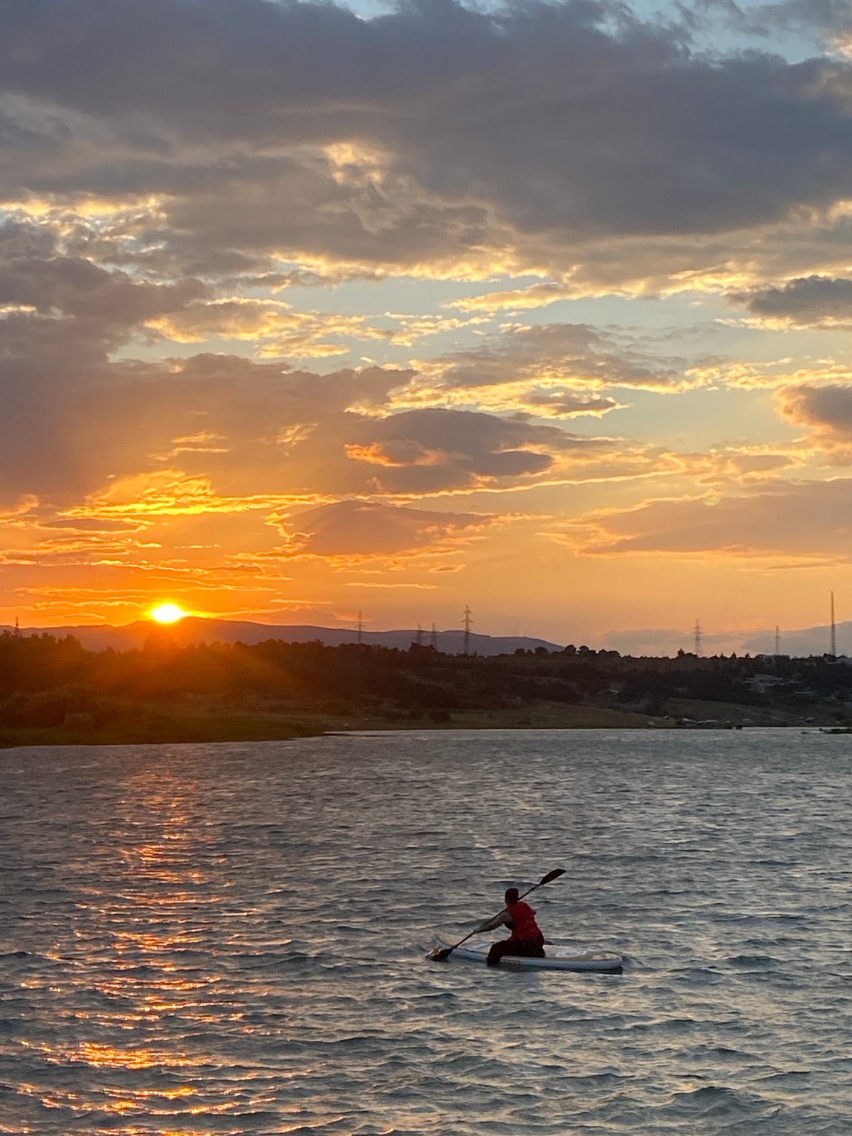Paddleboarding at golden hour on a Tbilisi reservoir