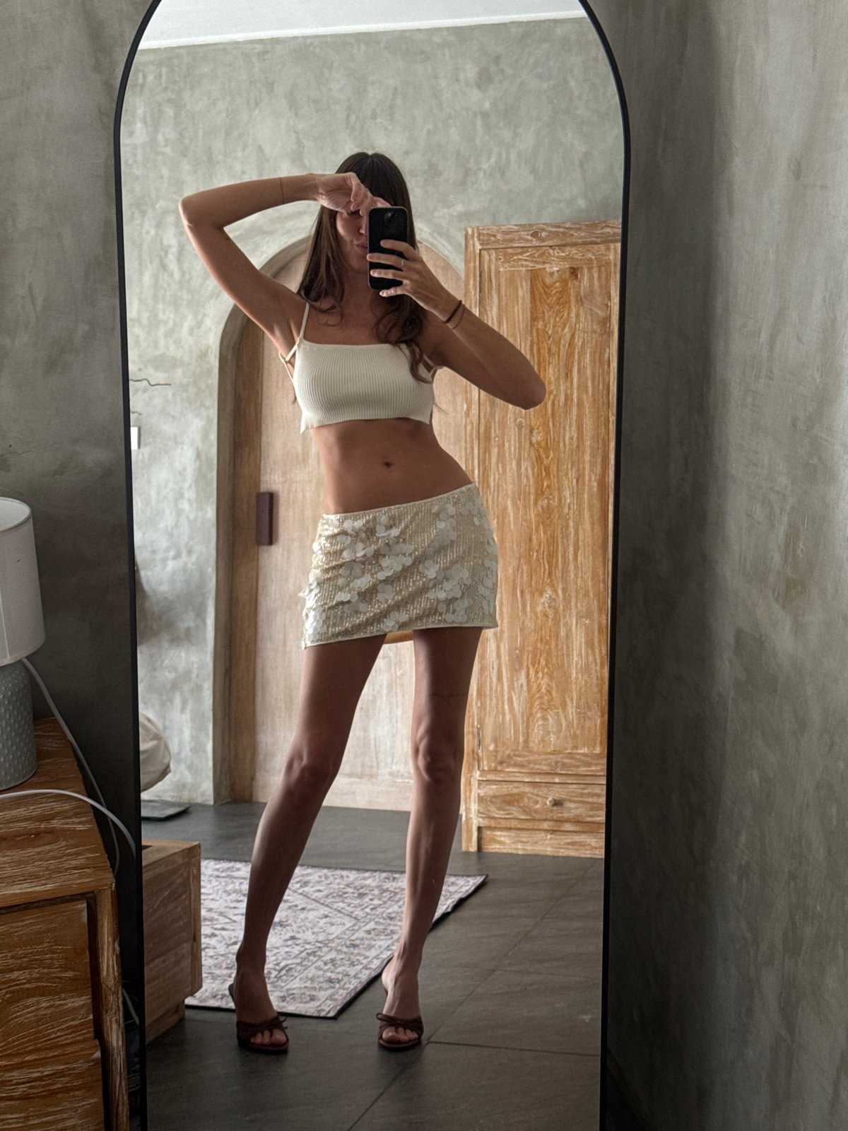 Woman takes mirror selfies in North Kuta, Indonesia