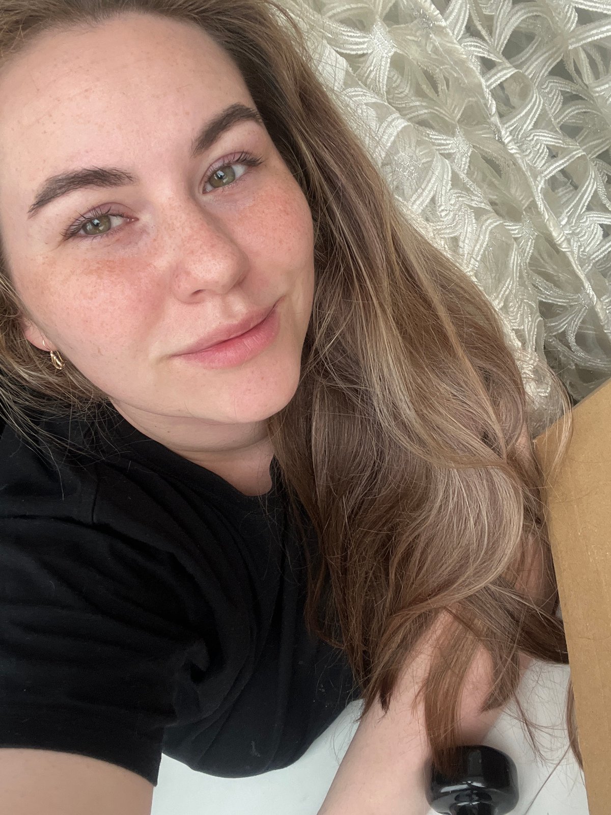 Woman and tabby cat share quiet morning moments in Chaikovsky