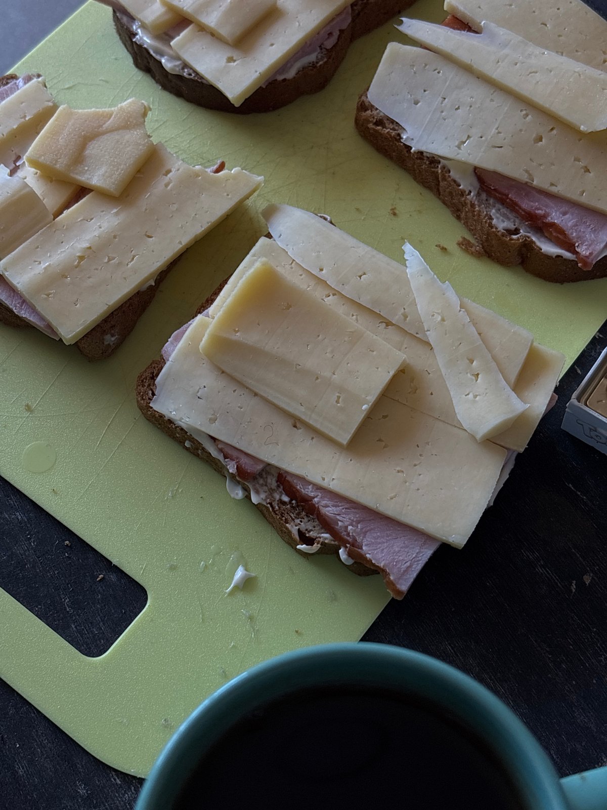 Open-faced sandwiches prepared on cutting board in Perm