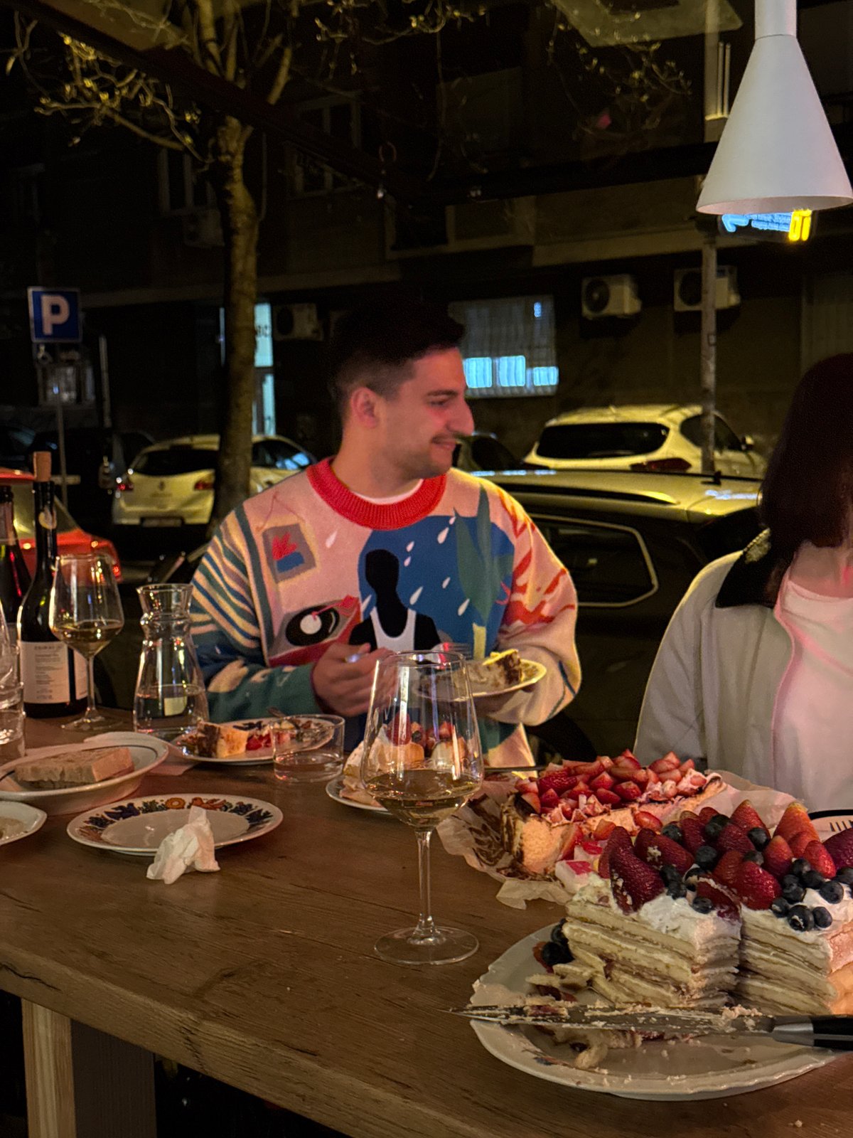 Group dining gathering with cake observed in Belgrade restaurant