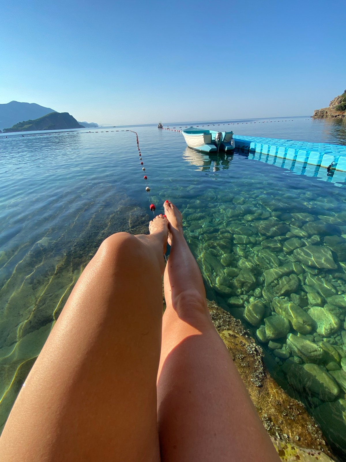 Rocky coastline morning in Budva — swimming, cliffs, clear water