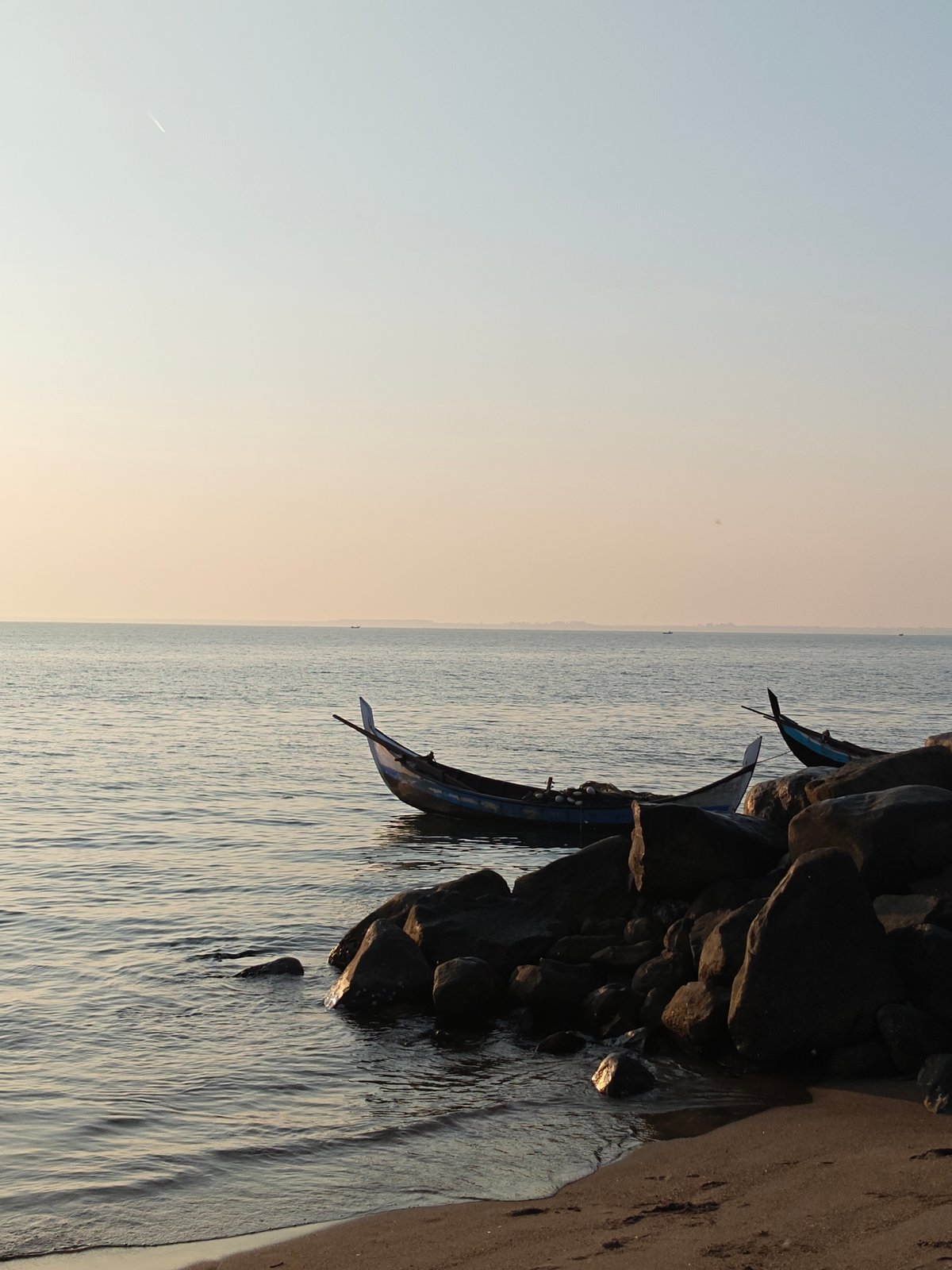 Traditional fishing boats spotted at dawn in Lhokseumawe, Indonesia