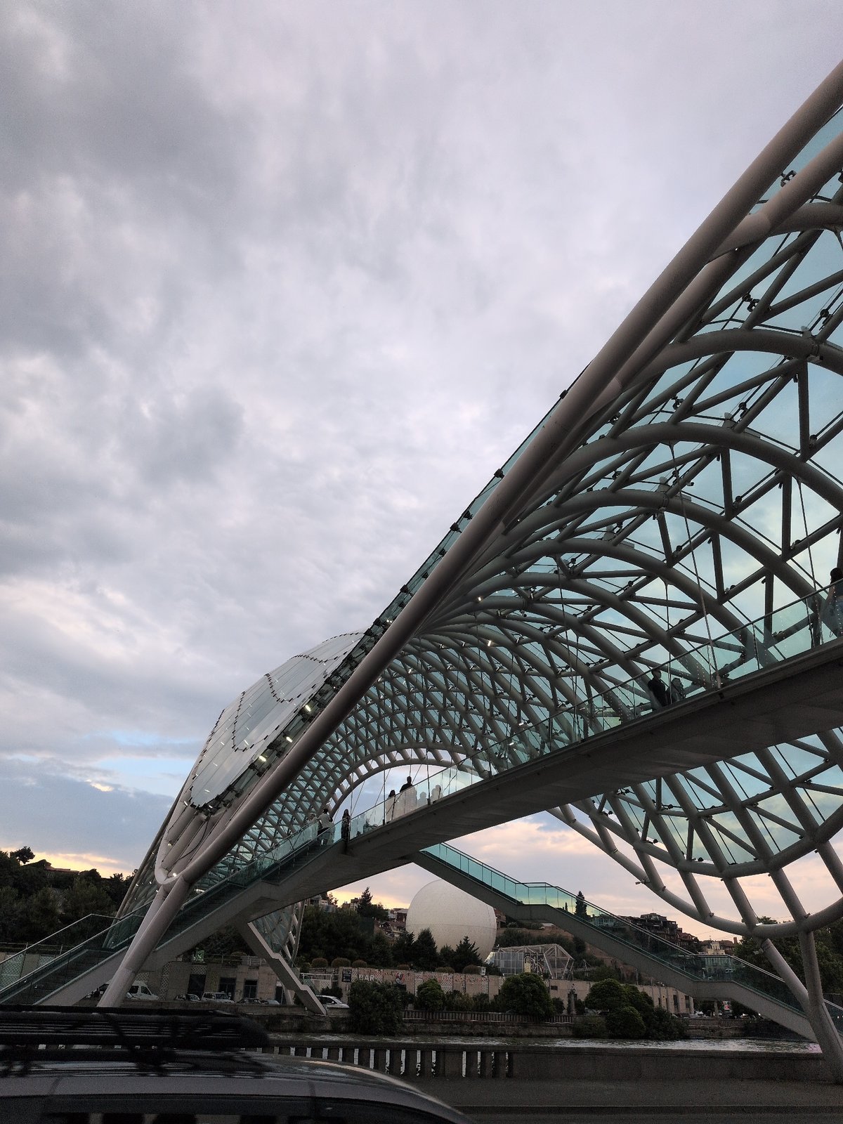 Tbilisi's modern riverfront landmarks on an overcast afternoon