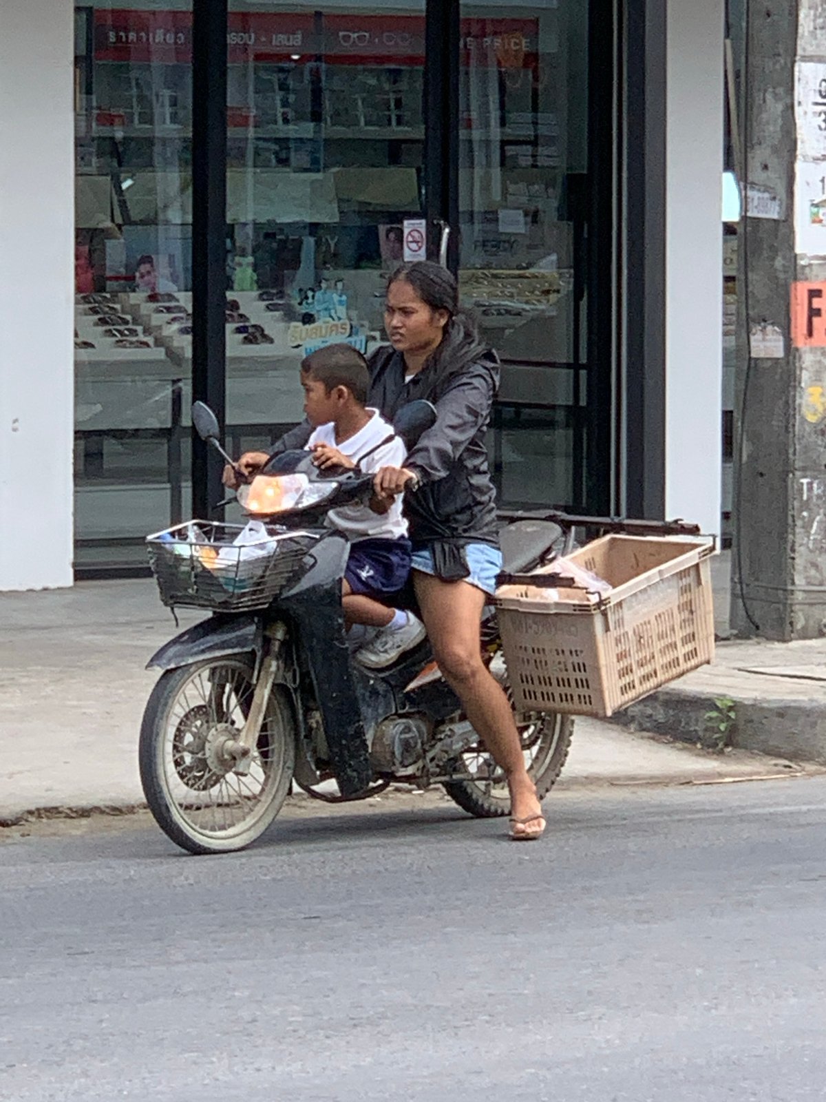 Morning street traffic and foot activity in Ko Samui District