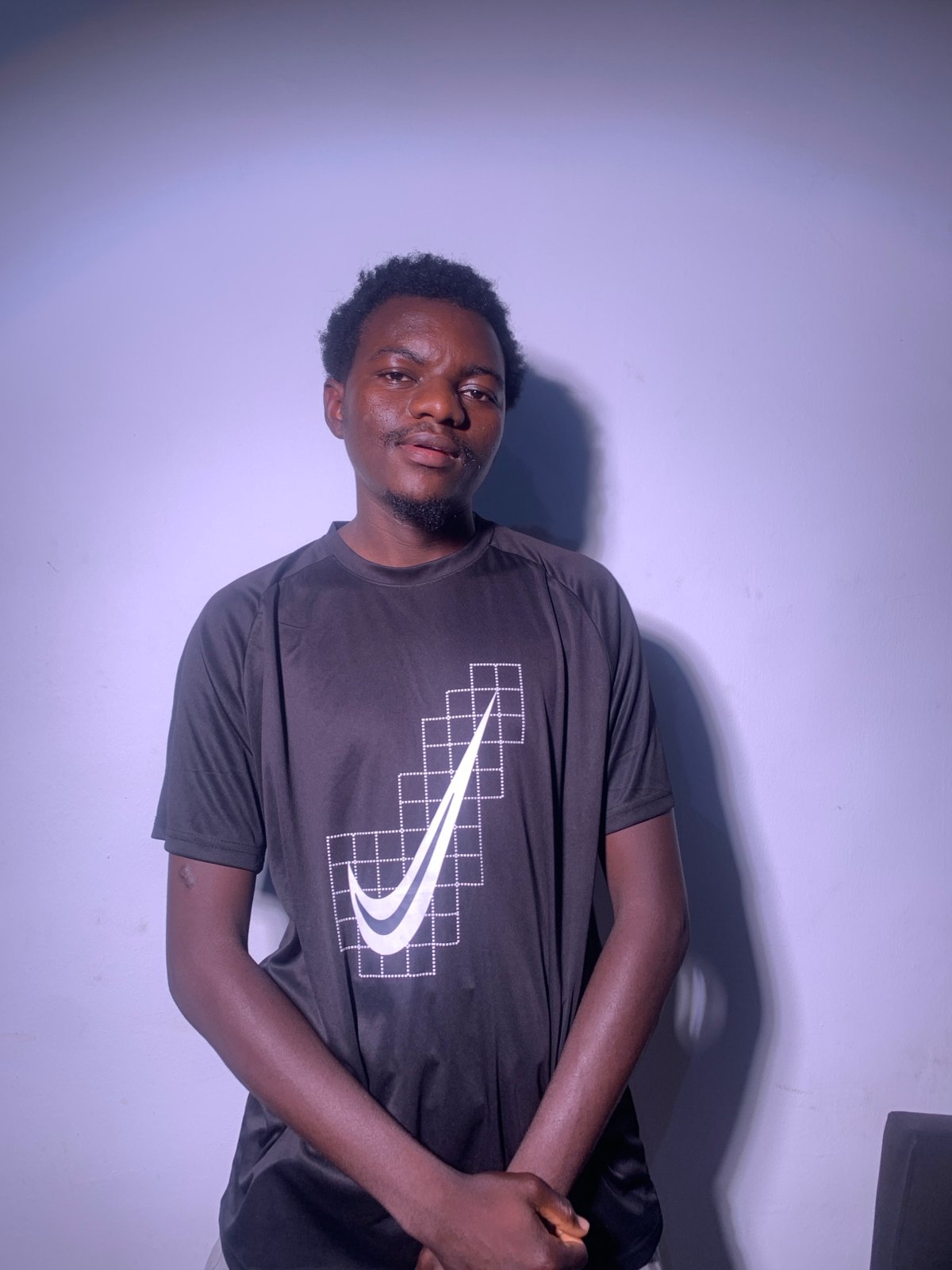 Studio portrait session in consistent Nike outfit, multiple angles.