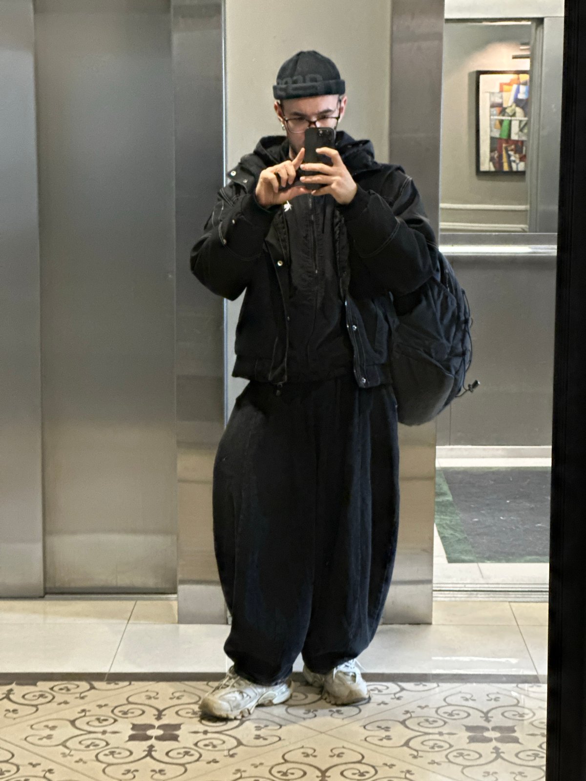 Person takes selfie in mirrored elevator in Khimki