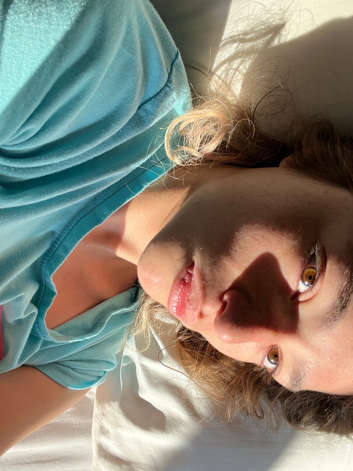 Woman takes selfies on bed in Mexican town