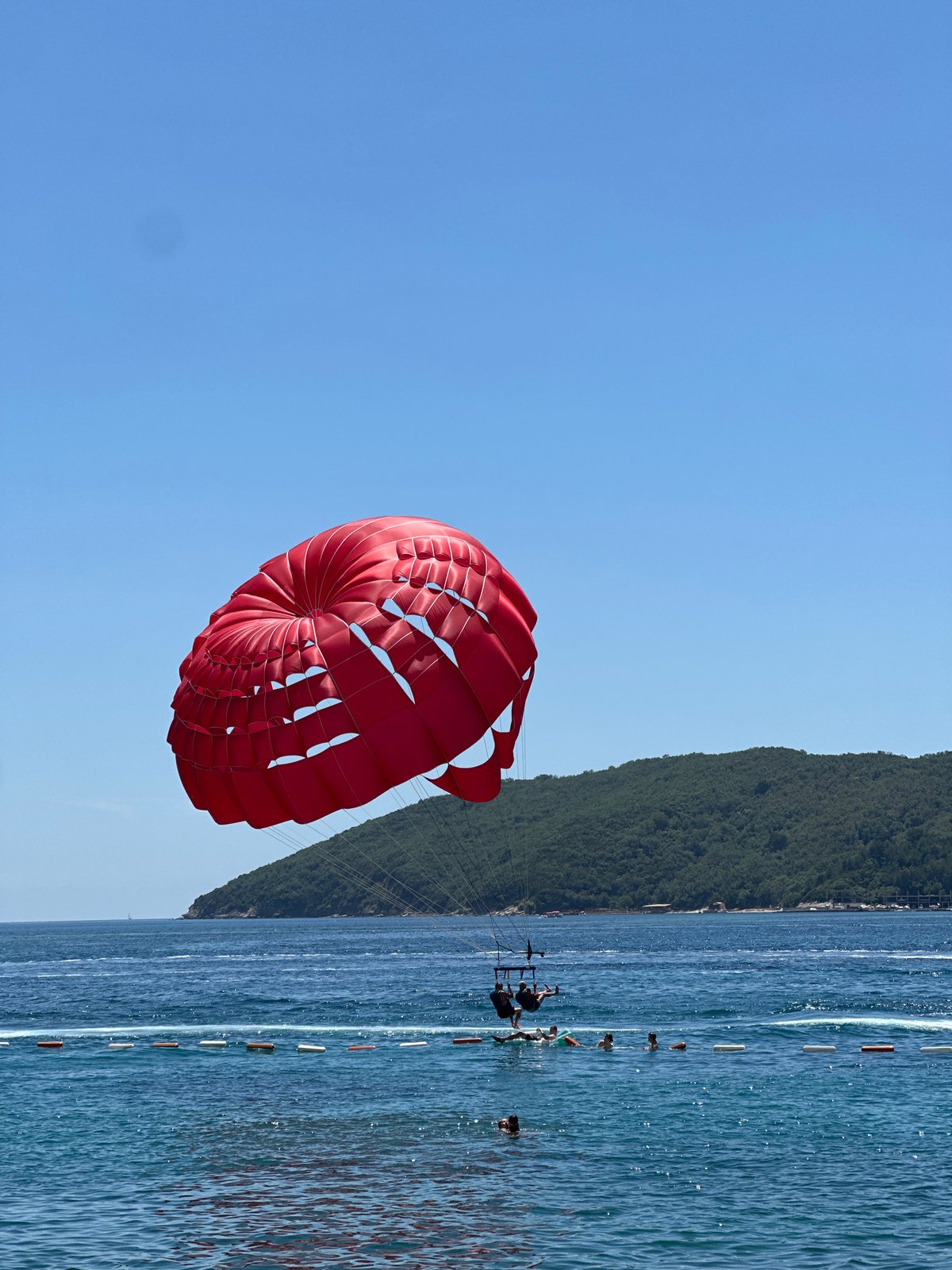 Summer morning in Budva: parasailing, coffee, and Adriatic beach vibes