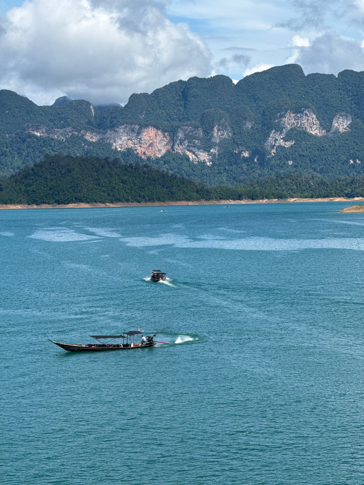 Cheow Lan Lake's turquoise waters and jungle mountains, Ban Ta Khun