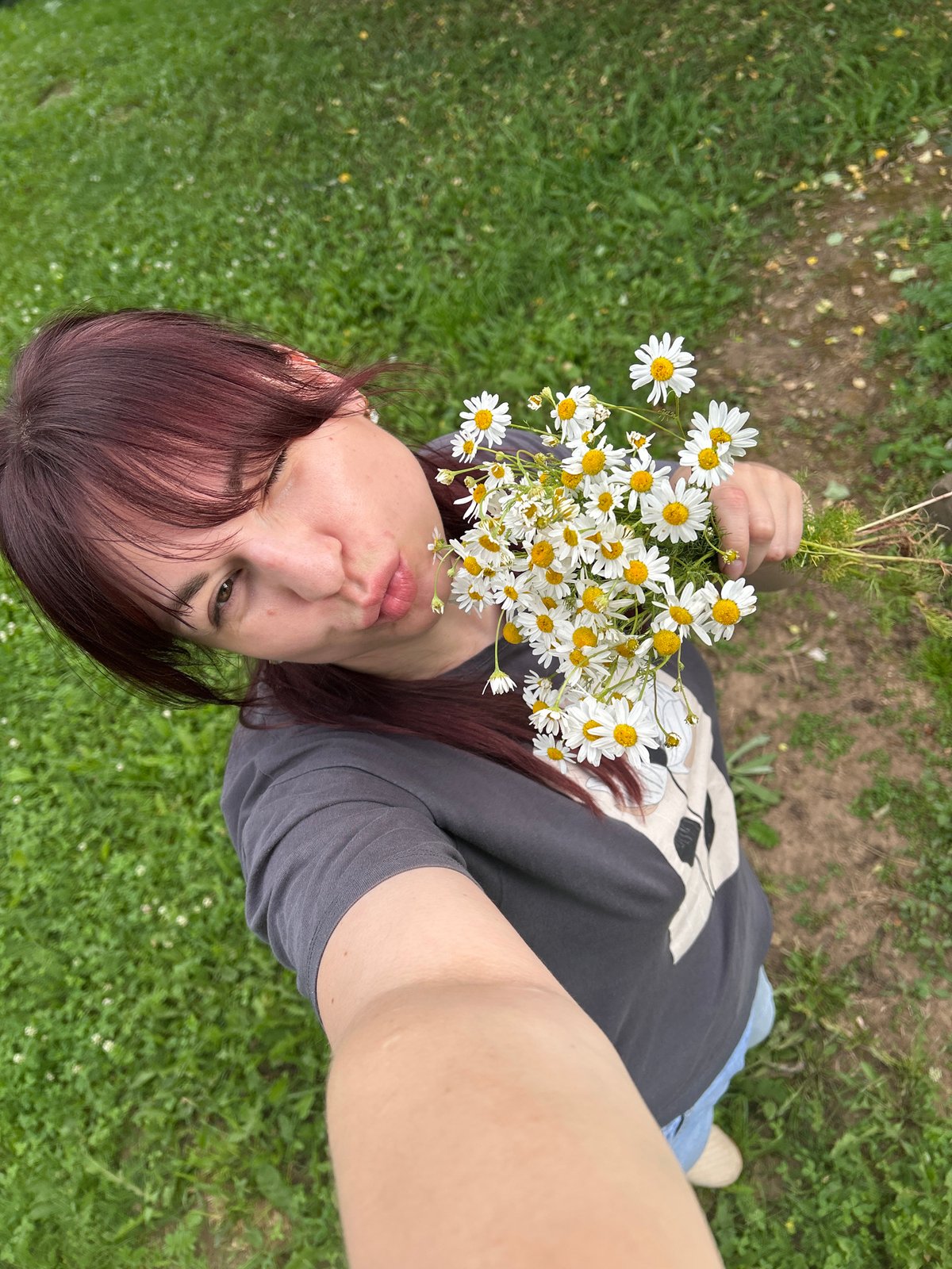 Lazy afternoon in the grass with a daisy bouquet